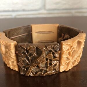 Carved ivory panel stretch bracelet featuring bird and foliage motifs